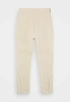 YOURTURN Trainingsbroek - Beige -YOURTURN WINKEL 90710507f8f5487cab8658ec2322153c
